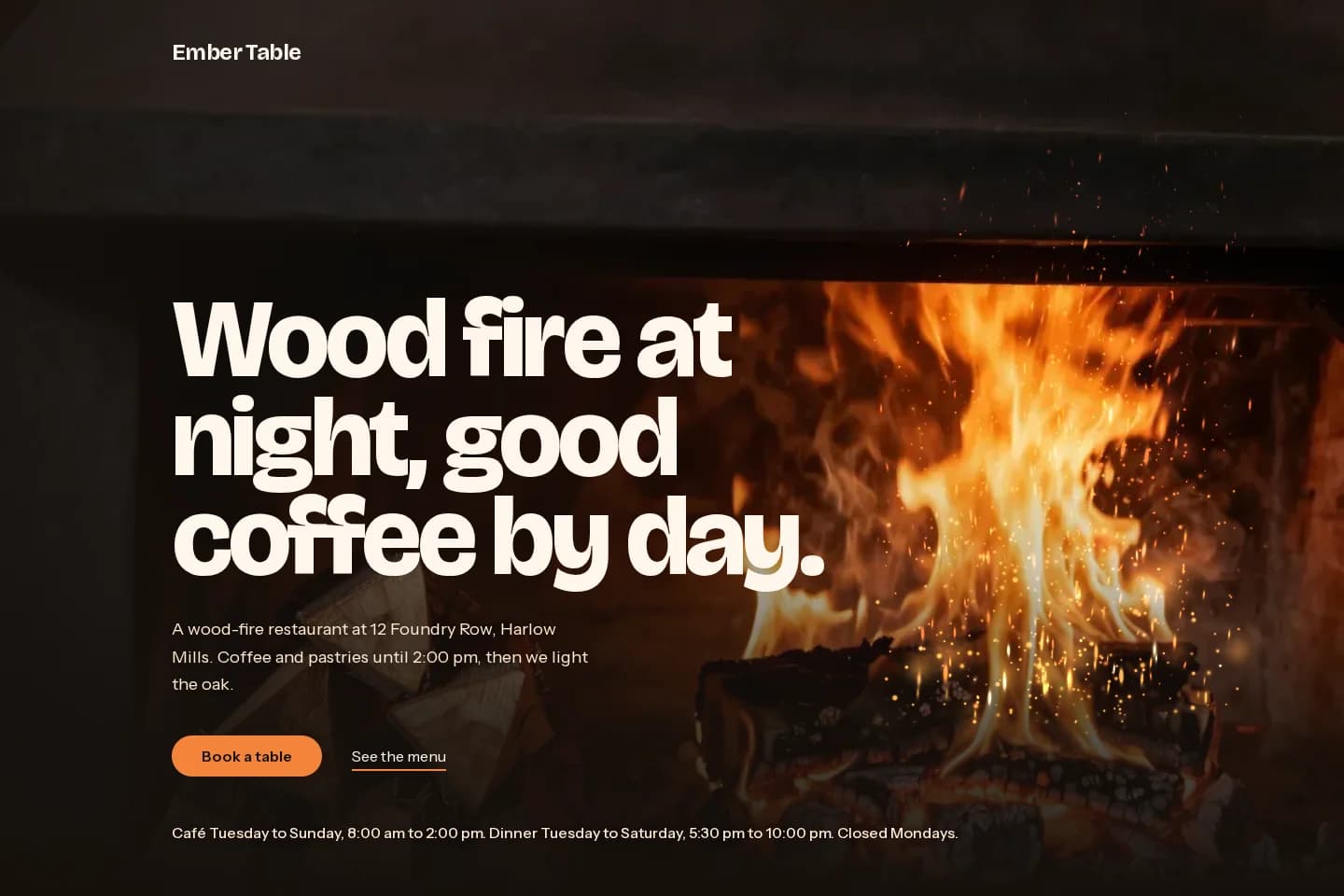 Ember Table hero: headline over a roaring wood fire with rising embers