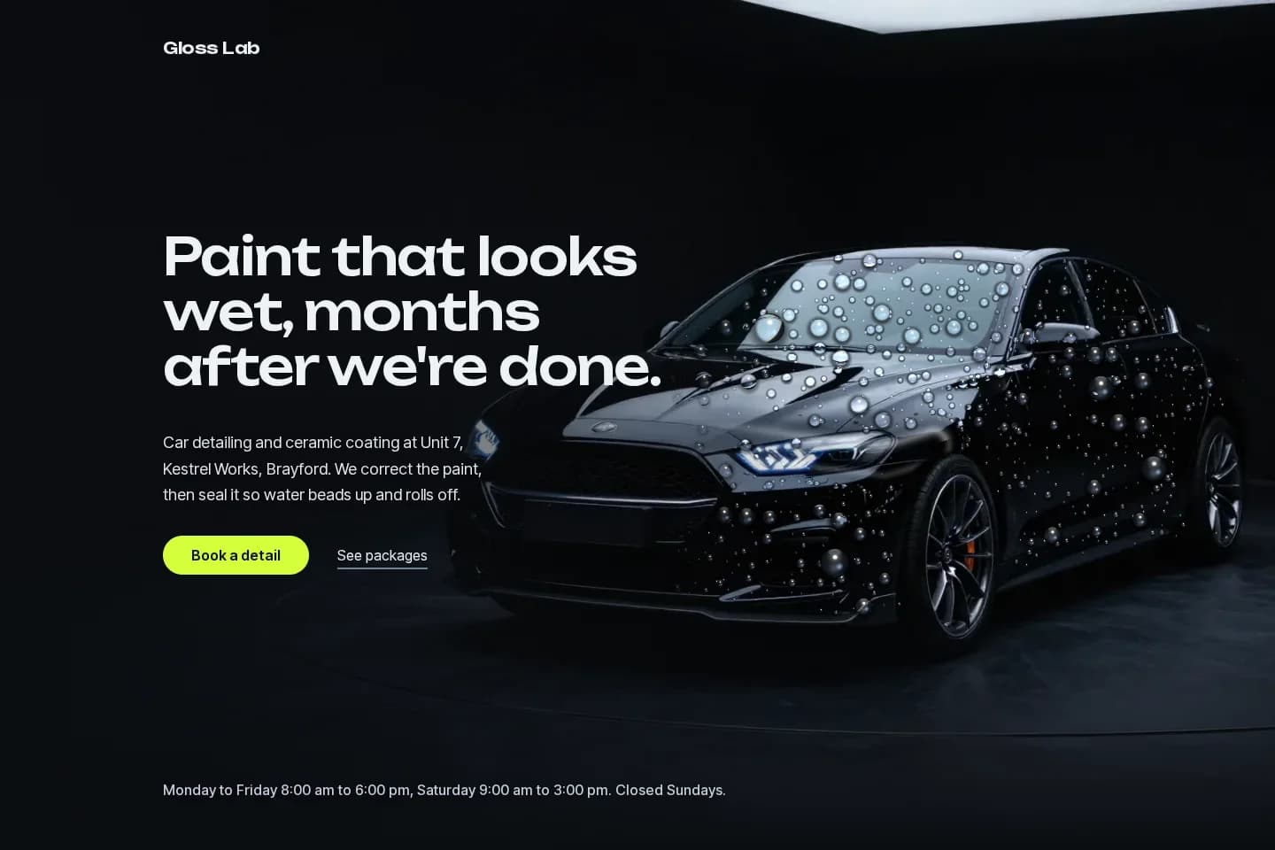 Gloss Lab hero: headline beside a black sedan covered in water beads in a dark studio