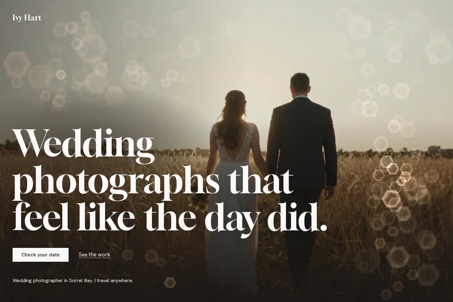 Ivy Hart Studio hero: headline over a couple walking through golden grass with hexagonal bokeh
